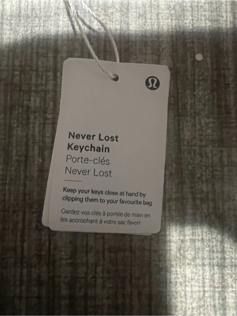 lululemon athletica Never Lost key strap in burgundy with logo